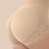 Beige shapewear with lace detailing on a beige background